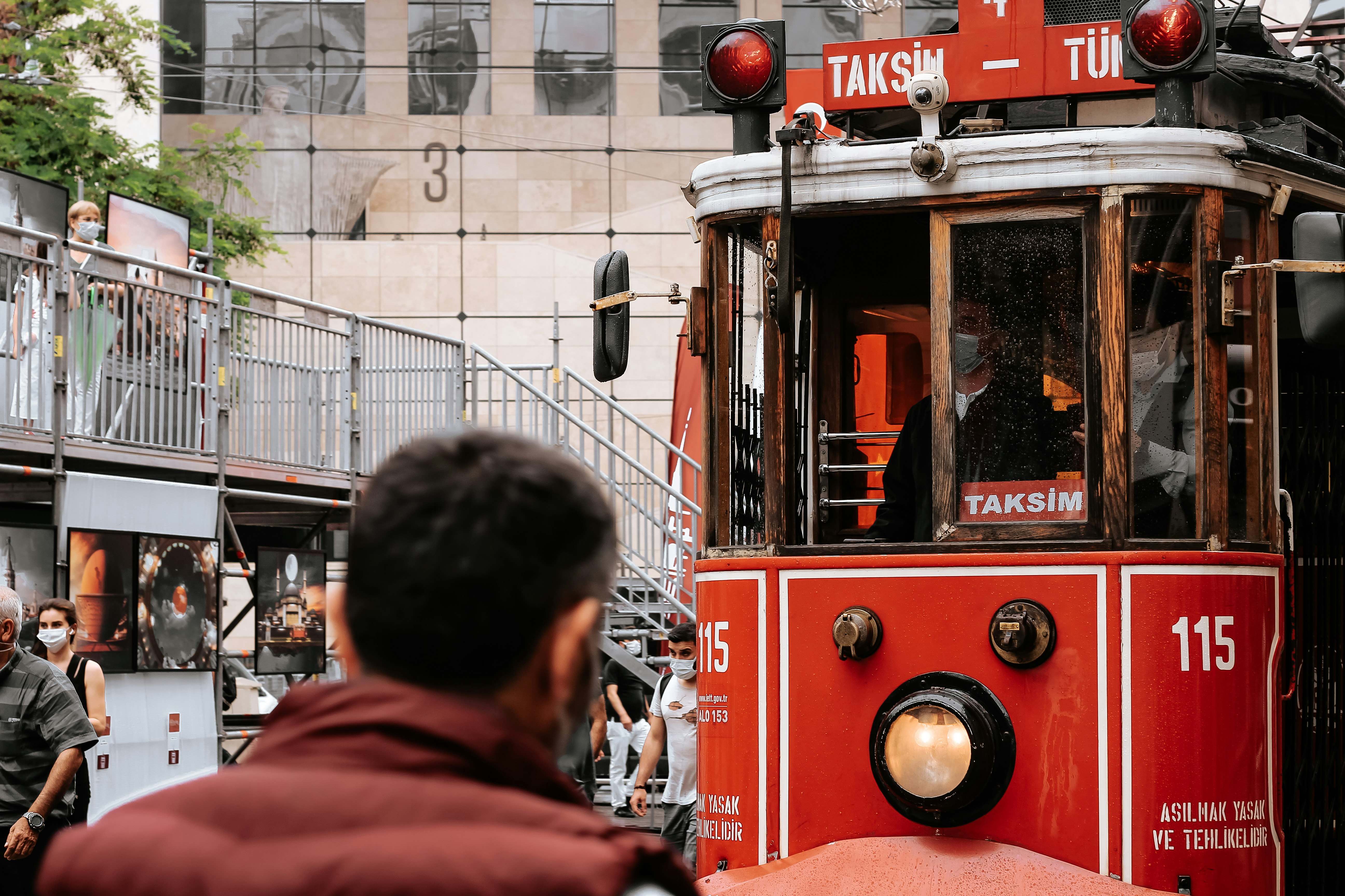 red and white tram on road near building during daytime